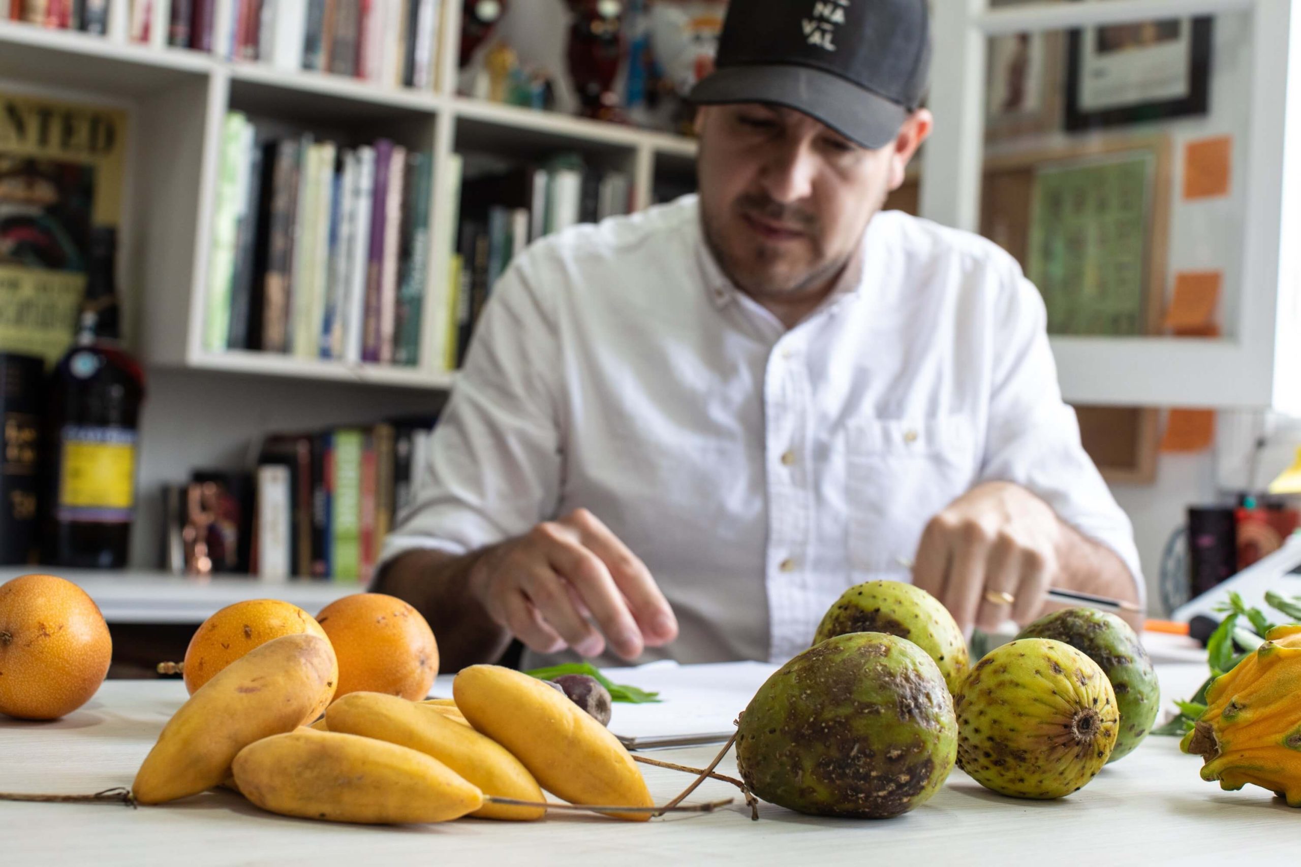 A man check some fruits on a table