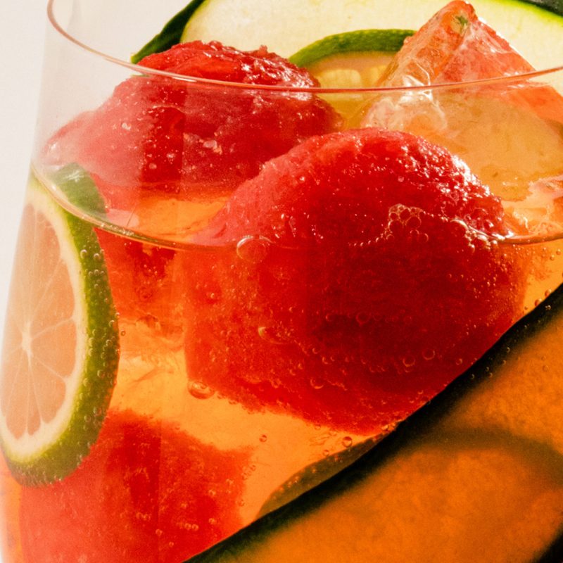 summery spritz featuring Aperol, SKYY, Watermelon, and Cucumber.