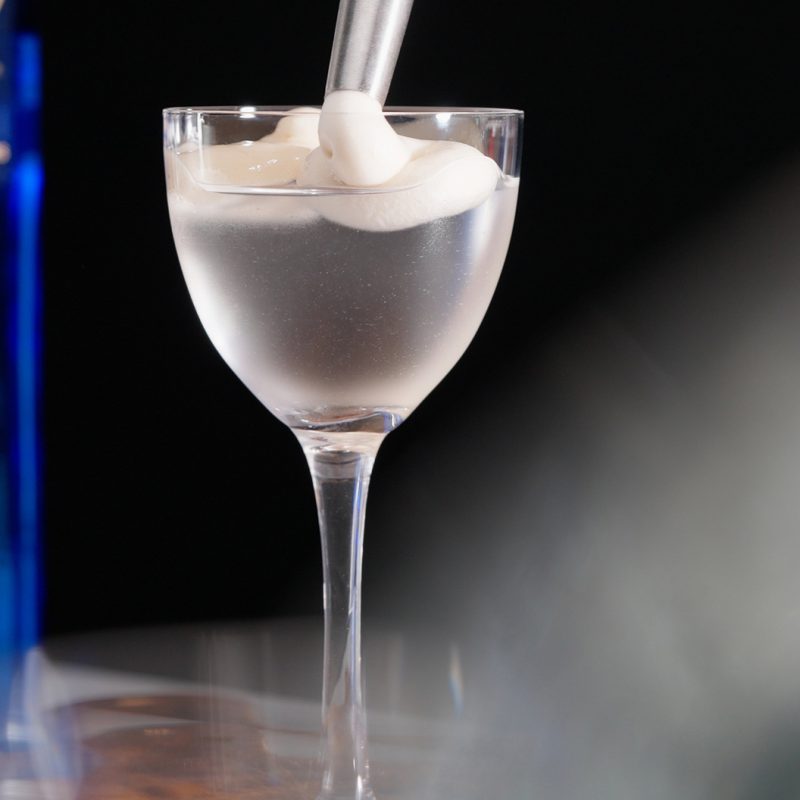 Photo of a clear espresso martini with foam top