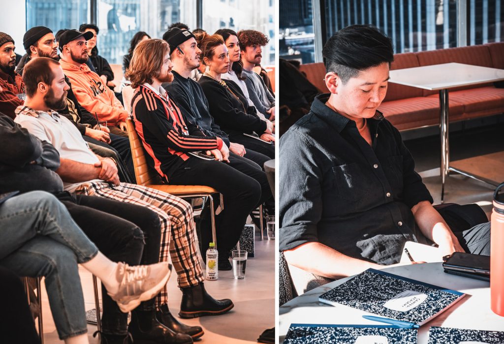 bartenders taking notes during guest lecture.